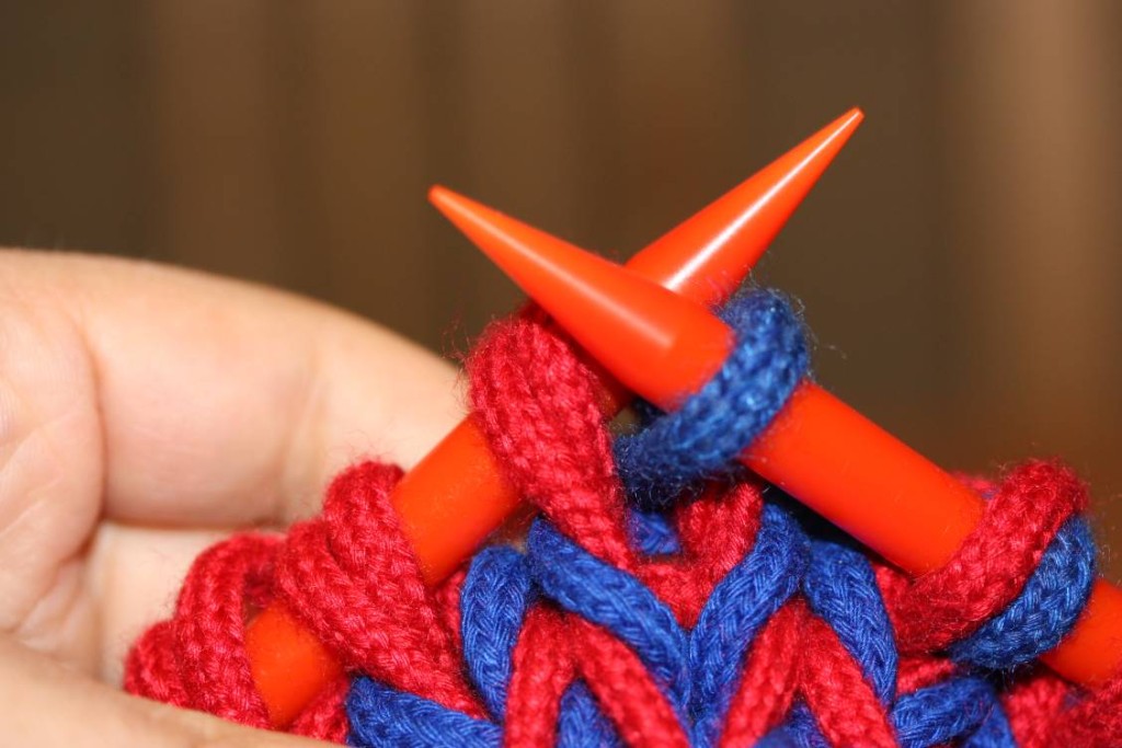 ...draw through both stitches on left needle...
