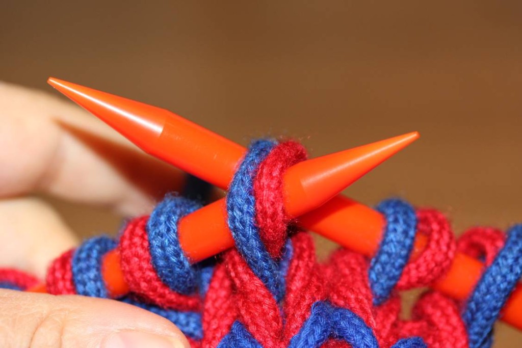Insert left needle through both stitches on right needle.