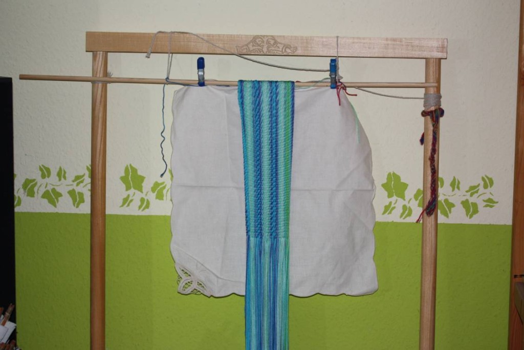 Circular sprang - this is one continuous loop; the white cloth is in there to help keep me less confused.