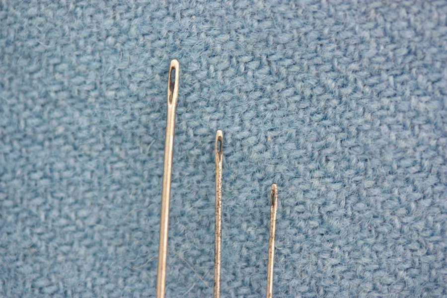 Closeup of the needle eyes. You can still see some of the dark oxidisation residue from the process of making the needles.